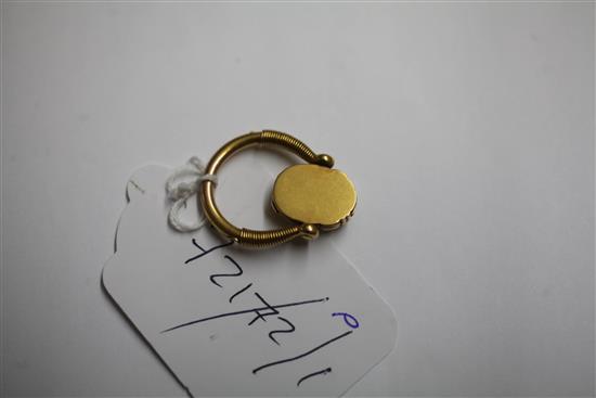 An early 20th century 14k gold swivelling Scarab locket ring, size N.